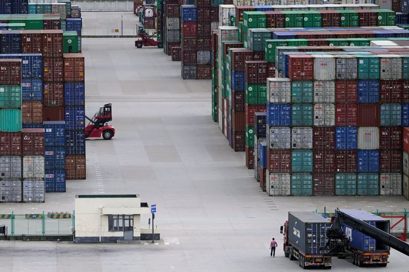 © Reuters. FILE PHOTO: Containers are seen at the Yangshan Deep-Water Port in Shanghai, China October 19, 2020. REUTERS/Aly Song