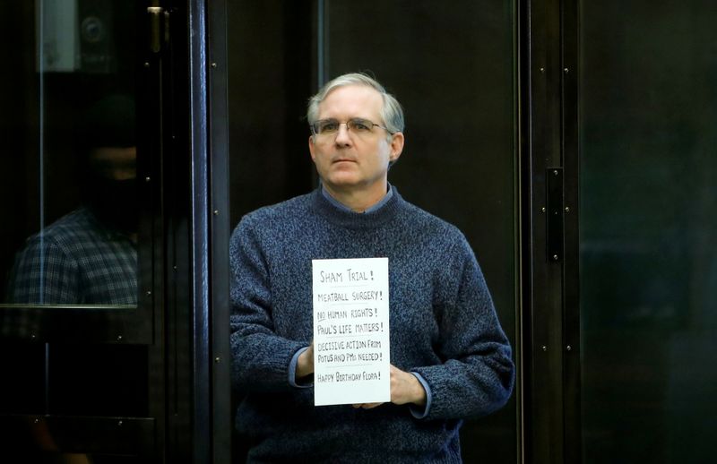 &copy; Reuters. FILE PHOTO: Former U.S. Marine Paul Whelan, who was detained and accused of espionage, holds a sign as he stands inside a defendants' cage during his verdict hearing in Moscow, Russia June 15, 2020. REUTERS/Maxim Shemetov/File Photo