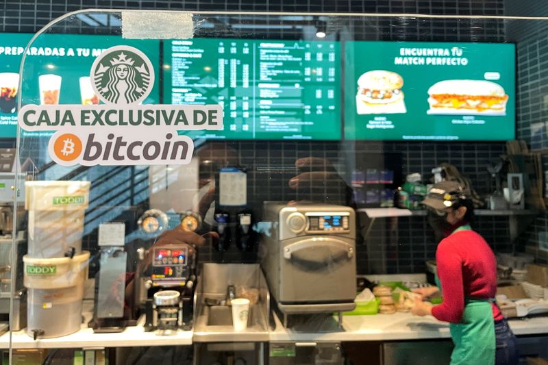 &copy; Reuters. A sign reads: "Exclusive Bitcoin register" in a Starbucks store where the cryptocurrency is accepted as a payment method, in San Salvador, El Salvador September 7, 2021. REUTERS/Jose Cabezas