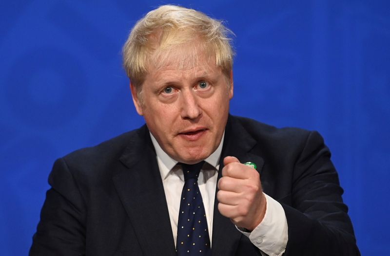 &copy; Reuters. Britain's Prime Minister Boris Johnson gestures as he speaks during a news conference with Britain's Chancellor of the Exchequer Rishi Sunak and Britain's Health Secretary Sajid Javid (not pictured) in Downing Street, in London, Britain, September 7, 2021