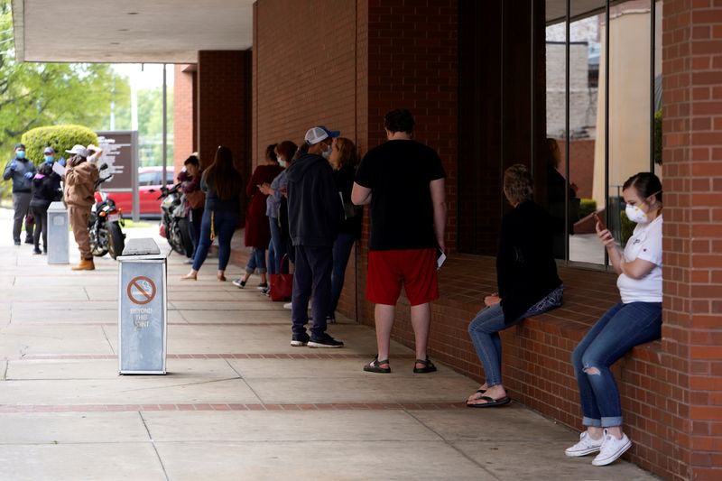 &copy; Reuters. People who lost their jobs wait in line to file for unemployment following an outbreak of the coronavirus disease (COVID-19), at an Arkansas Workforce Center in Fort Smith, Arkansas, U.S. April 6, 2020. REUTERS/Nick Oxford