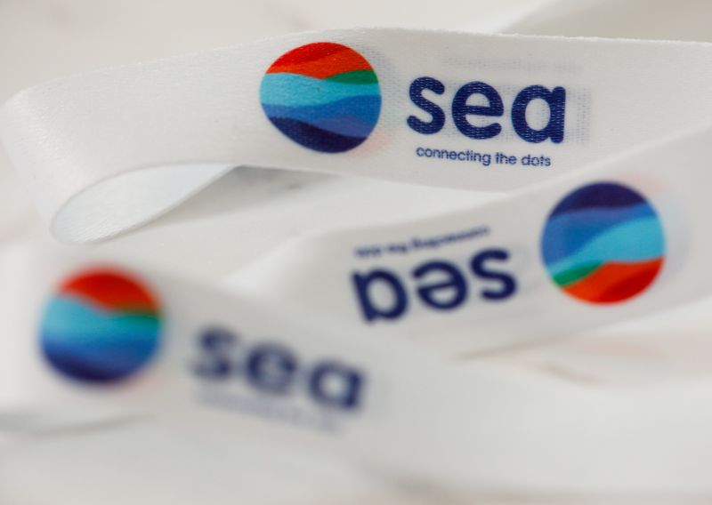 &copy; Reuters. FILE PHOTO: A lanyard showing logos of Southeast Asian e-commerce and gaming group Sea Ltd is pictured at its office in Singapore, March 5, 2021. REUTERS/Edgar Su/File Photo
