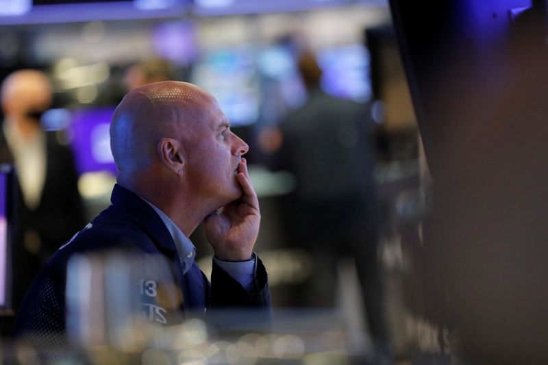 &copy; Reuters. FILE PHOTO: A trader works at the New York Stock Exchange (NYSE) in Manhattan, New York City, U.S., August 19, 2021. REUTERS/Andrew Kelly