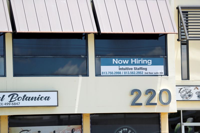 &copy; Reuters. FILE PHOTO: A staffing agency displays a "Now Hiring" sign in Tampa, Florida, U.S., June 1, 2021. REUTERS/Octavio Jones/File Photo