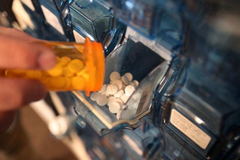 &copy; Reuters. FILE PHOTO: A pharmacist refills a container in a drug dispensing machine at the Rock Canyon pharmacy in Provo, Utah, U.S., May 9, 2019.  REUTERS/George Frey