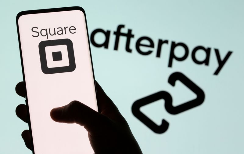 &copy; Reuters. Smartphone with Square logo is seen in front of displayed Afterpay logo in this illustration taken, August 2, 2021. REUTERS/Dado Ruvic/Illustration