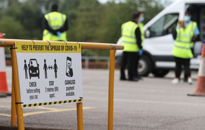 &copy; Reuters. FILE PHOTO: A sign indicates safety measures at a testing centre near the Crown and Anchor pub following a spike in cases of the coronavirus disease (COVID-19) to visitors of the pub in Stone, Britain, July 30, 2020. REUTERS/Carl Recine