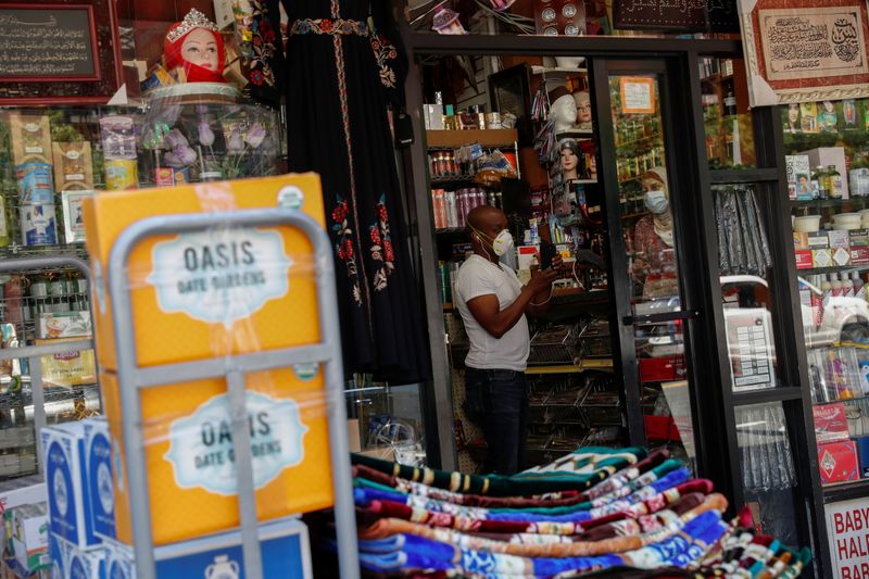 &copy; Reuters. A shopkeeper works inside his retail store as the phase one reopening of New York City continues during the outbreak of the coronavirus disease (COVID-19) in the Brooklyn borough of New York City, New York, U.S. June 9, 2020. REUTERS/Shannon Stapleton