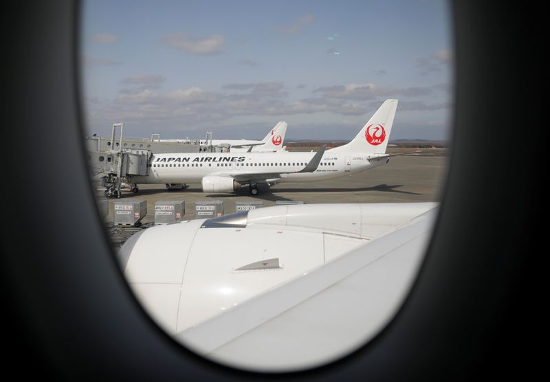 &copy; Reuters. FILE PHOTO: Japan Airlines (JAL) planes sit on the tarmac at New Chitose Airport, in Sapporo, Hokkaido, Japan May 4, 2021. REUTERS/Issei Kato