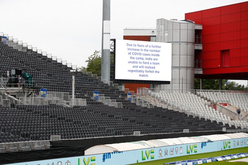© Reuters. Cricket - Fifth Test - England v India - Emirates Old Trafford, Manchester, Britain - September 10, 2021 A message is seen displayed on a big screen after the match was cancelled due to members of the India staff contracting COVID-19 Action Images via Reuters/Jason Cairnduff