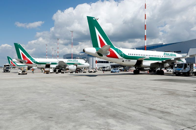 © Reuters. FILE PHOTO: Alitalia planes are seen on the tarmac at Fiumicino International Airport as talks between Italy and the European Commission over the revamp of Alitalia are due to enter a key phase, in Rome, Italy, April 15, 2021. REUTERS/Remo Casilli/File Photo