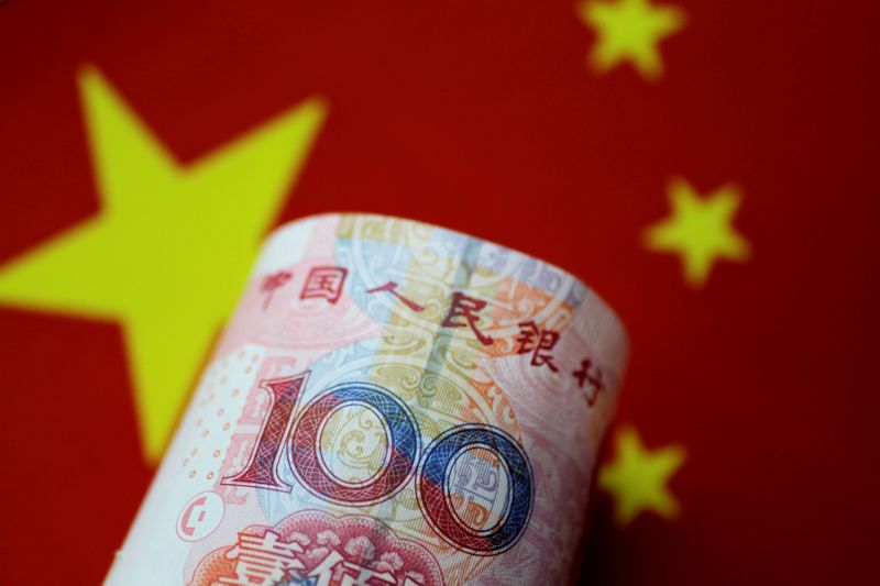 &copy; Reuters. FILE PHOTO: A China yuan note is seen in this illustration photo May 31, 2017.  REUTERS/Thomas White/Illustration