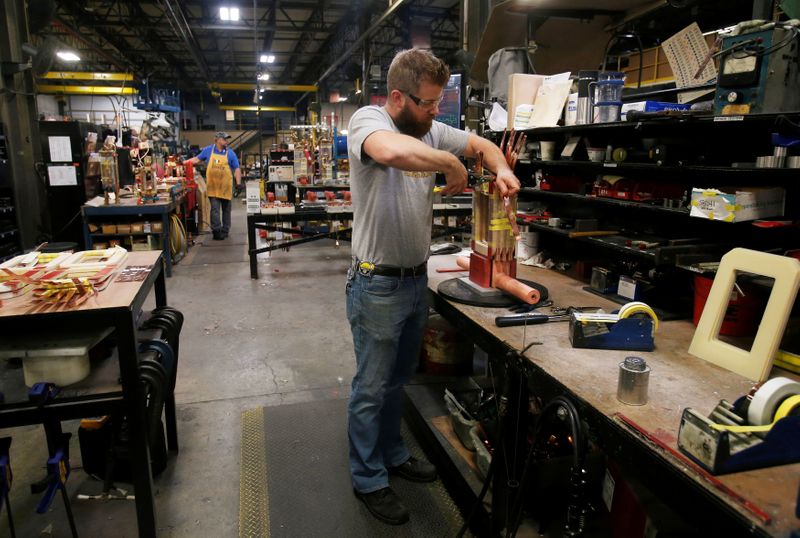 © Reuters. Sub-assembly worker Joel Dykema works on the sub-assembly of a transformer in the RoMan Manufacturing plant in Grand Rapids, Michigan, U.S. December 12, 2018.    REUTERS/Rebecca Cook