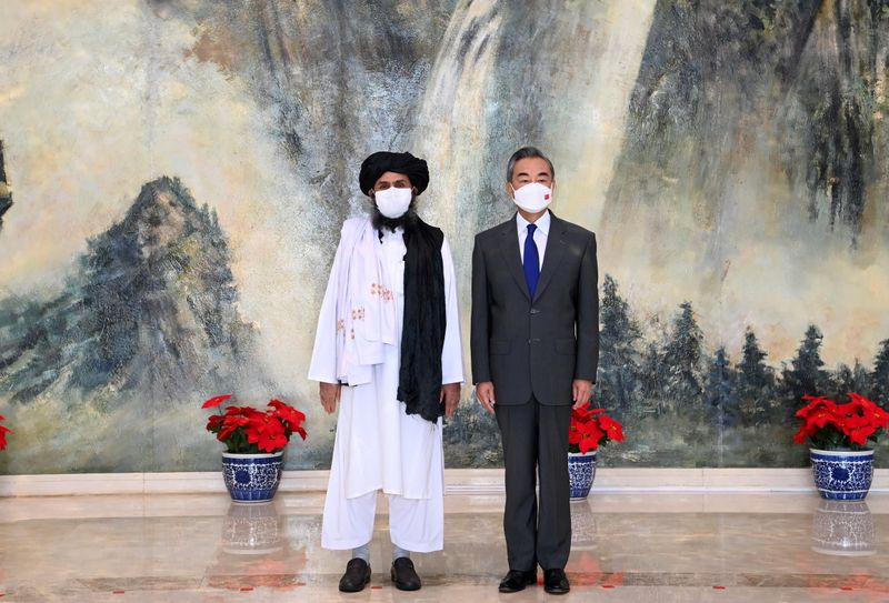 &copy; Reuters. FILE PHOTO: Chinese State Councilor and Foreign Minister Wang Yi meets with Mullah Abdul Ghani Baradar, political chief of Afghanistan's Taliban, in Tianjin, China July 28, 2021.  Li Ran/Xinhua via REUTERS  