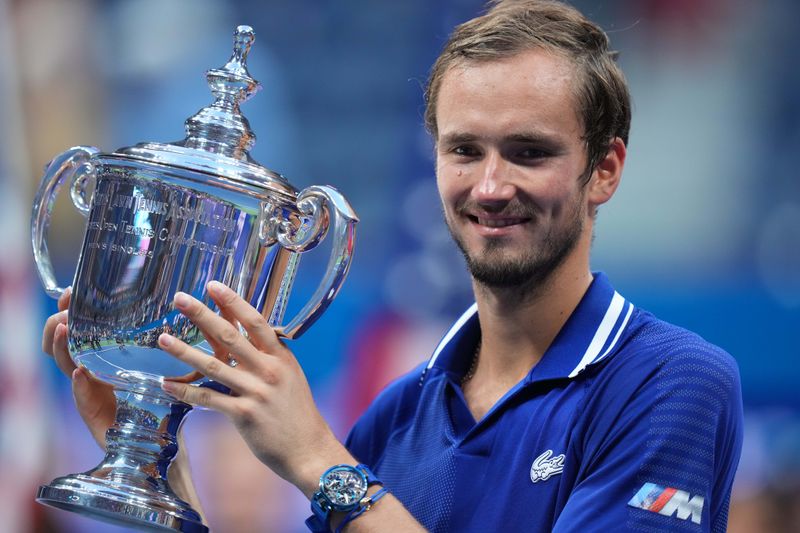 © Reuters. Sep 12, 2021; Flushing, NY, USA; Daniil Medvedev of Russia celebrates with the championship trophy after his match against Novak Djokovic of Serbia (not pictured) in the men's singles final on day fourteen of the 2021 U.S. Open tennis tournament at USTA Billie Jean King National Tennis Center. Mandatory Credit: Danielle Parhizkaran-USA TODAY Sports