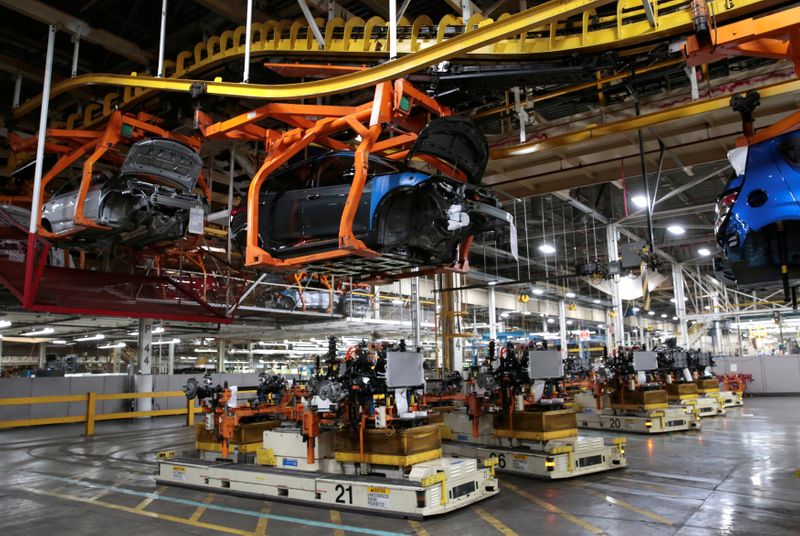 &copy; Reuters. FILE PHOTO: Automated Guided Vehicles transport the chassis for 2018 Chevrolet Bolt EV vehicles on the assembly line at General Motors Orion Assembly in Lake Orion, Michigan, U.S., March 19, 2018.  Photo taken March 19, 2018.   REUTERS/Rebecca Cook