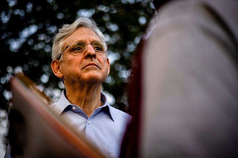 &copy; Reuters. FILE PHOTO: Merrick Garland, U.S. attorney general, listens to community leaders while visiting youth baseball games held by the Chicago Westside Sports at Columbus Park in Chicago, Illinois, U.S., July 22, 2021. Samuel Corum/Pool via REUTERS/File Photo