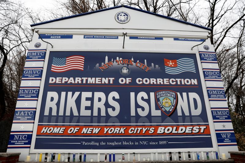 &copy; Reuters. FILE PHOTO: Candles are seen on the sign marking the entrance to the New York City Department of Corrections Rikers Island facility in Queens, in New York, U.S., February 14, 2018. REUTERS/Shannon Stapleton/File Photo