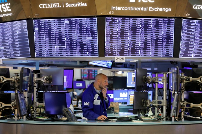 &copy; Reuters. FILE PHOTO: A trader works on the trading floor at the New York Stock Exchange (NYSE) in Manhattan, New York City, U.S., August 9, 2021. REUTERS/Andrew Kelly