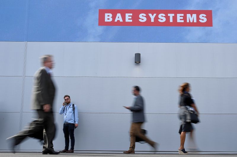 &copy; Reuters. FILE PHOTO: Trade visitors walk past an advertisement for BAE Systems at Farnborough International Airshow in Farnborough, Britain, July 17, 2018. REUTERS/Toby Melville