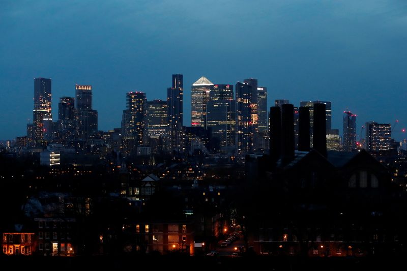 &copy; Reuters. FILE PHOTO:  View of Canary Wharf business district at dusk in London, Britain March 9, 2021. REUTERS/Peter Cziborra/File photo