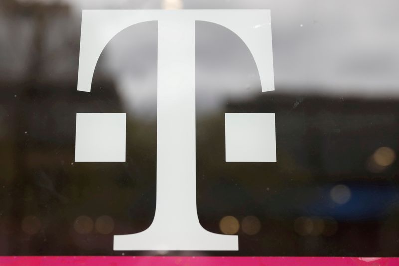 © Reuters. FILE PHOTO: A T-Mobile logo is seen on the storefront door of a store in Manhattan, New York, U.S., April 30, 2018. REUTERS/Shannon Stapleton/File Photo