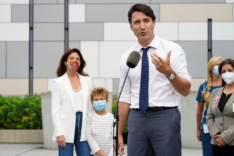 &copy; Reuters. FILE PHOTO: Canada's Liberal Prime Minister Justin Trudeau speaks while hs wife Sophie Gregoire Trudeau and their son Hadrien Trudeau listen at an election campaign stop in Vancouver, British Columbia Canada September 13, 2021. REUTERS/Carlos Osorio