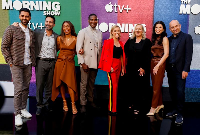 &copy; Reuters. FILE PHOTO: Cast member and executive producer Reese Witherspoon (in red) poses with co-stars Hasan Minhaj, Nestor Carbonell, Karen Pittman, Desean K. Terry, Julianna Margulies and director Mimi Leder and executive producer Michael Ellenberg at a photo ca