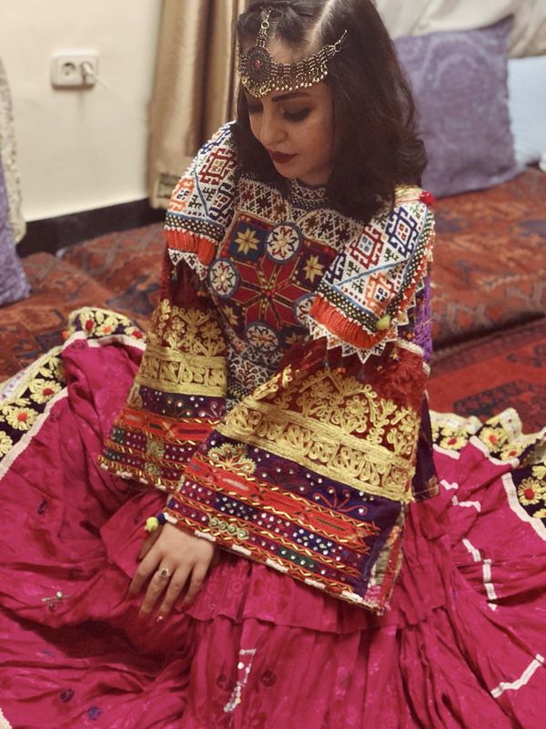 'This is how we dress': Afghan women overseas pose in colourful attire