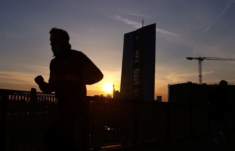&copy; Reuters. A runner passes the European Central Bank (ECB) headquarters during sunset as the spread of the coronavirus disease (COVID-19) continues in Frankfurt, Germany, April 8, 2021.  REUTERS/Kai Pfaffenbach