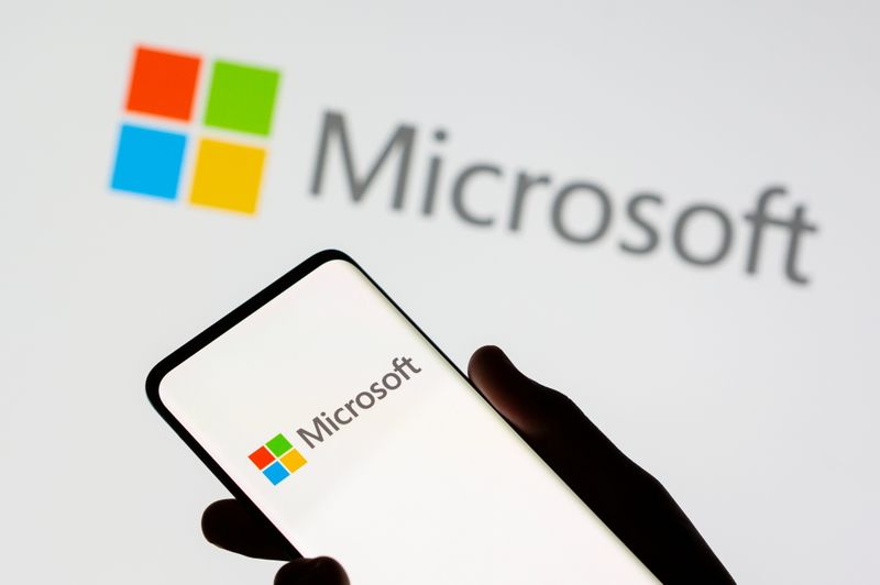&copy; Reuters. FILE PHOTO: A smartphone is seen in front of a Microsoft logo displayed in this illustration taken, July 26, 2021. REUTERS/Dado Ruvic/Illustration/File Photo