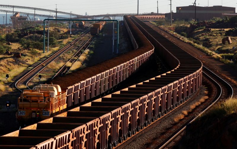 &copy; Reuters. FILE PHOTO: A train loaded with iron ore travels towards the Rio Tinto Parker Point iron ore facility as an empty train leaves in Dampier at the Pilbarra region in western Australia April 20, 2011.  REUTERS/Daniel Munoz//File Photo