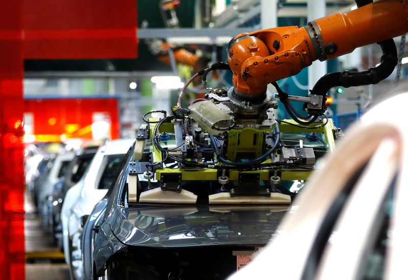 &copy; Reuters. FILE PHOTO: A robot engineered by Kuka adjusts a windscreen in a fully automated process on a model of the A-class production line of German car manufacturer Mercedes Benz at the Daimler factory in Rastatt, Germany, February 4, 2019. REUTERS/Kai Pfaffenba
