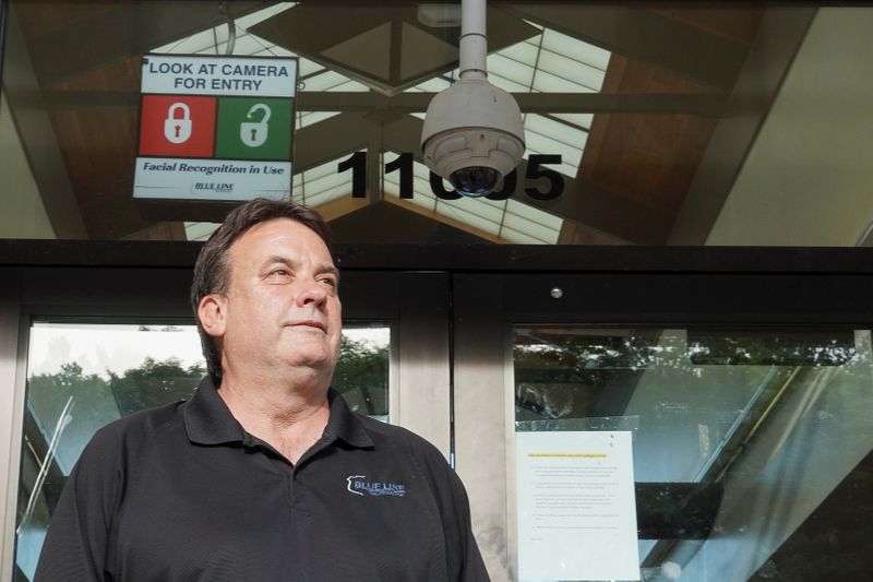 &copy; Reuters. Co-Founder Thomas Sawyer stands in front of his facial recognition system from the company Blue Line Technology, at a convenience store in St. Louis, Missouri, U.S., June 14, 2021. Picture taken June 14, 2021. REUTERS/Lawrence Bryant