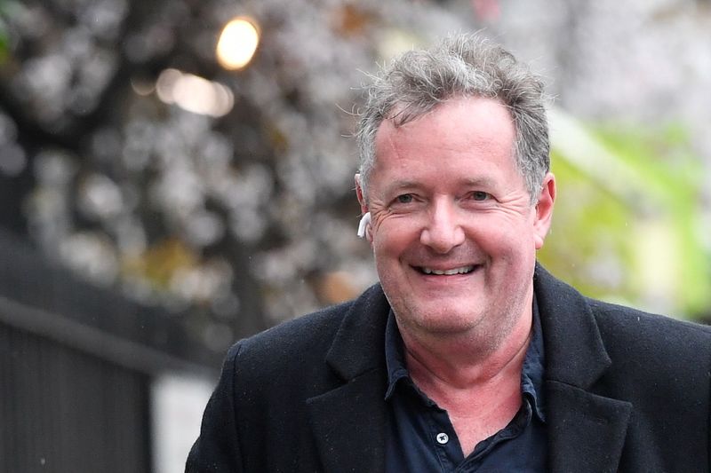 &copy; Reuters. FILE PHOTO: Journalist and television presenter Piers Morgan smiles as he walks near his house, after he left his high-profile breakfast slot with the broadcaster ITV, following his long-running criticism of Prince Harry's wife Meghan, in London, Britain,