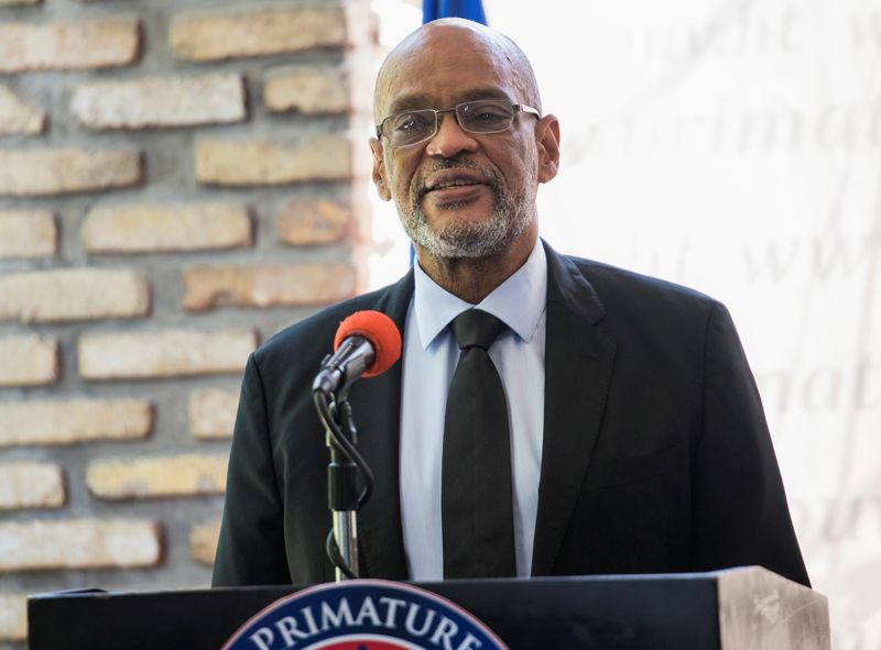 Under scrutiny in murder inquiry, Haiti's PM receives international backing