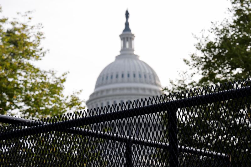 &copy; Reuters. FILE PHOTO: A security fence, erected in a single overnight effort, surrounds the U.S. Capitol ahead of an expected rally Saturday in support of the January 6 defendants in Washington, DC, U.S., September 16, 2021. REUTERS/Jonathan Ernst