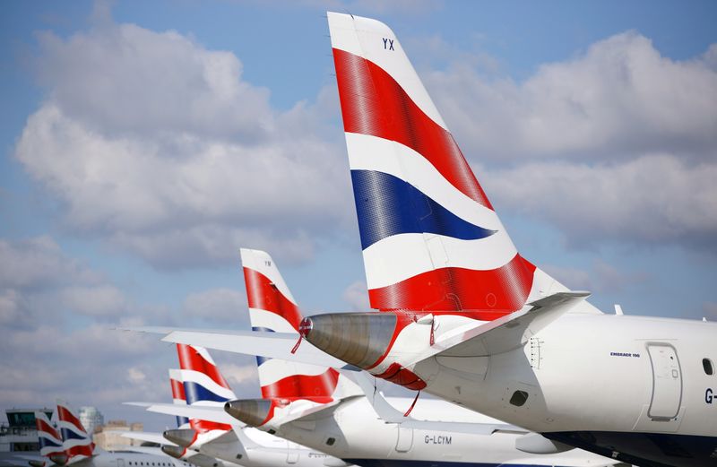 &copy; Reuters. FILE PHOTO: Tail fins of British Airways Embraer 190 aircraft are pictured at London City Airport, Britain, April 29, 2021. REUTERS/John Sibley/File Photo