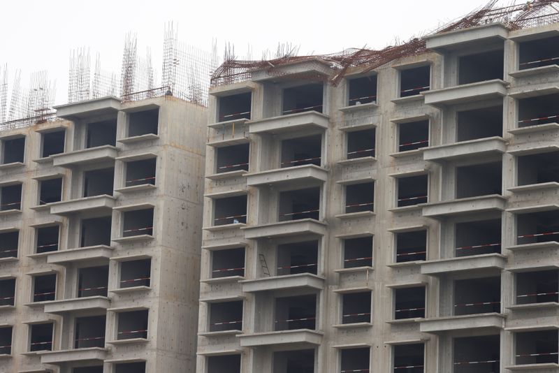 &copy; Reuters. Unfinished residential buildings are pictured at the Evergrande Oasis, a housing complex developed by Evergrande Group, in Luoyang, China September 16, 2021. Picture taken September 16, 2021. REUTERS/Carlos Garcia Rawlins