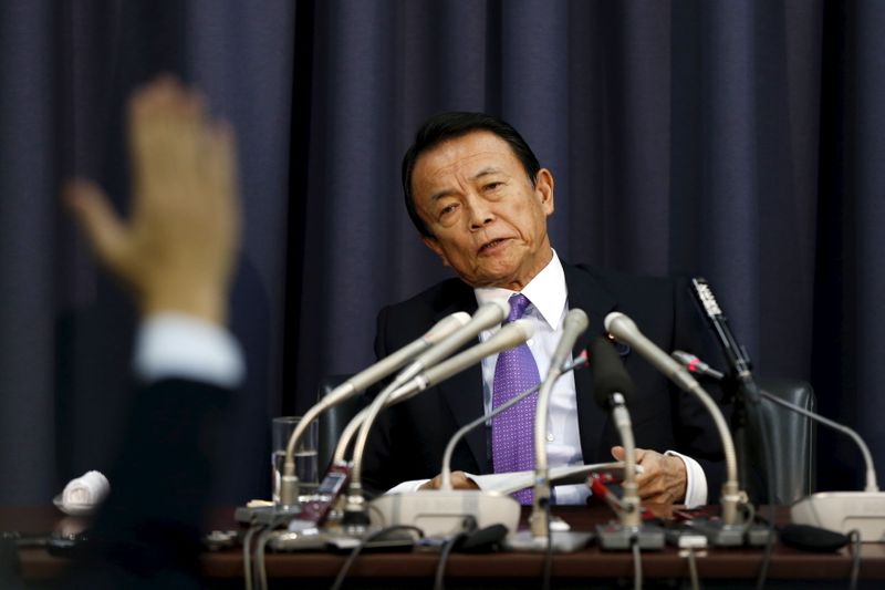 &copy; Reuters. Japan's Finance Minister Taro Aso attends a news conference as a reporter raises his hand for a question at the Finance Ministry in Tokyo December 24, 2015. REUTERS/Issei Kato/Files