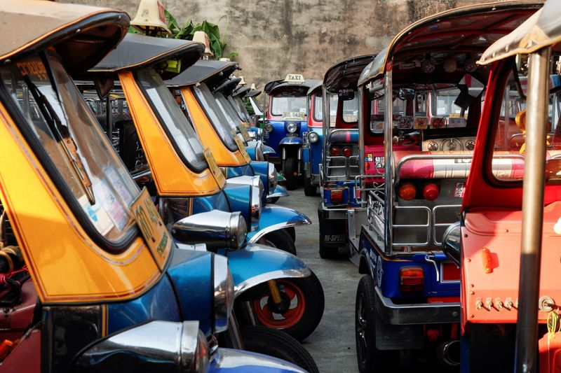 &copy; Reuters. FILE PHOTO: Tuk-tuks used to transport tourists around the city are seen idle due to travel bans and border closures from the global coronavirus disease (COVID-19) outbreak in a parking lot in downtown Bangkok, Thailand February 3, 2021. Picture taken Feb