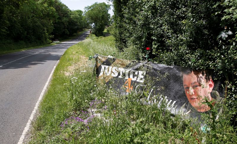 &copy; Reuters. A banner and a memorial area for British teenager Harry Dunn who died in a road traffic collision is pictured near to the entrance of RAF Croughton, in Croughton, near Brackley, Britain June 11, 2021. REUTERS/Andrew Boyers