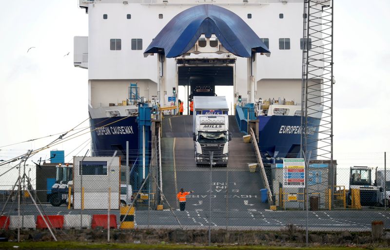 © Reuters. FILE PHOTO: Lorries leave a ferry at the Port of Larne, Northern Ireland Britain January 1, 2021. REUTERS/Phil Noble