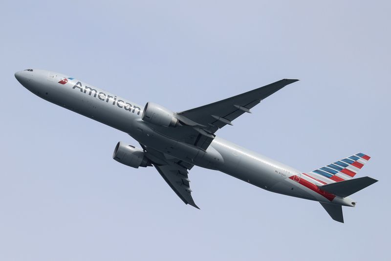 &copy; Reuters. FILE PHOTO: An American Airlines Boeing 777-300ER plane takes off from Sydney Airport in Sydney, Australia, October 28, 2020.  REUTERS/Loren Elliott/File Photo