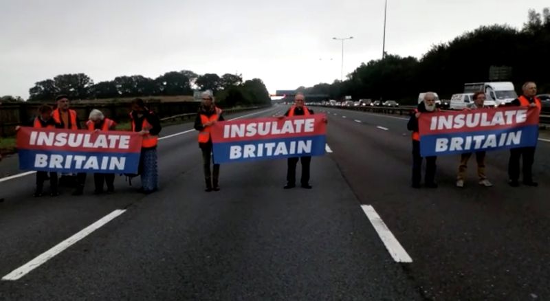 &copy; Reuters. Members of Insulate Britain protest on M25 Motorway, Britain September 15, 2021, in this still image taken from a handout video. Insulate Britain/Handout via REUTERS