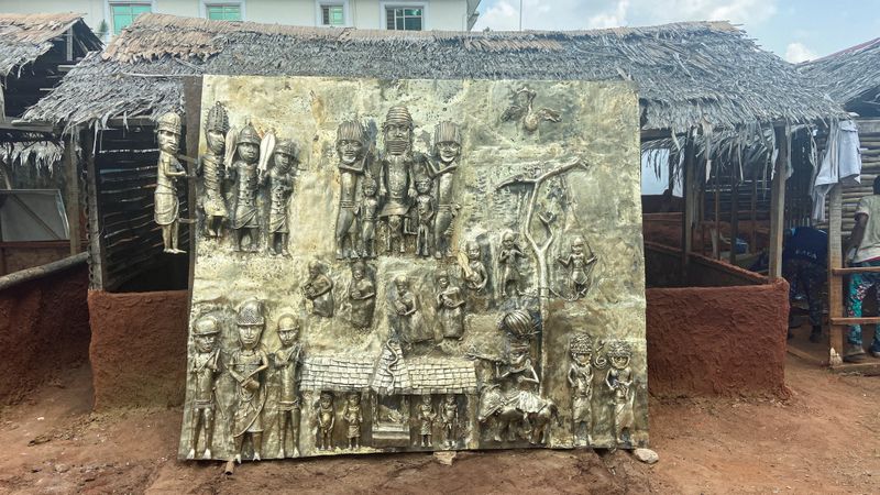 &copy; Reuters. A newly made bronze plaque depicting historical events in West Africa's once mighty Kingdom of Benin, which is being offered as a gift to the British Museum, is seen on display in Benin City, Nigeria, July 31, 2021. REUTERS/Tife Owolabi