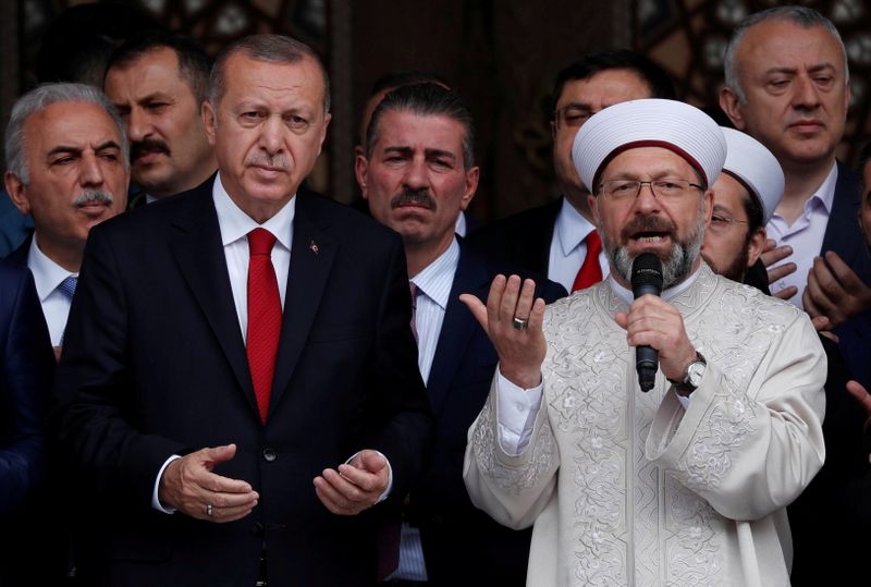 &copy; Reuters. FILE PHOTO: Turkish President Tayyip Erdogan, accompanied by head of Turkey's Religious Affairs Directorate Ali Erbas, prays during the opening ceremony of a mosque in Istanbul, Turkey, May 24, 2019. REUTERS/Murad Sezer/File Photo