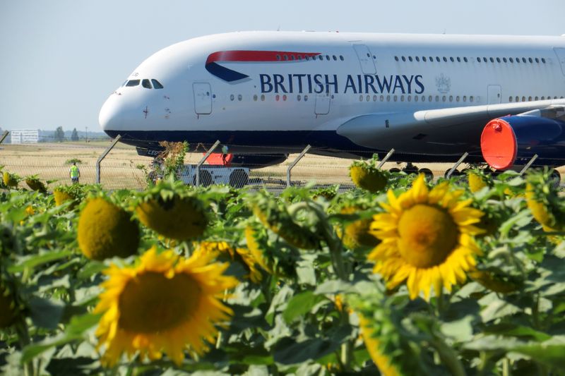 &copy; Reuters. FILE PHOTO: Technicians move a British Airways Airbus A380 airplane stored on the tarmac of Marcel-Dassault airport at Chateauroux, following the outbreak of the coronavirus disease (COVID-19) in France July 30, 2020. REUTERS/Pascal Rossignol/File Photo