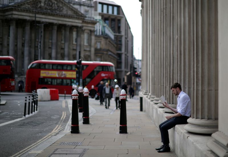 &copy; Reuters. FILE PHOTO: A person reads a book outside the Bank of England in London, Britain, September 13, 2021. REUTERS/Hannah McKay