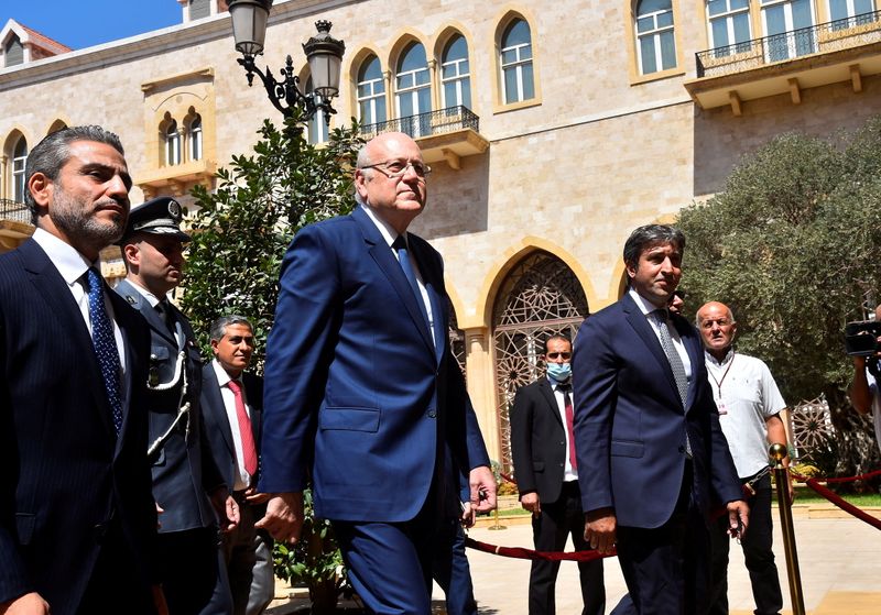&copy; Reuters. FILE PHOTO: Lebanon's new Prime Minister Najib Mikati walks during an official ceremony to mark his assumption of duties at the Government Palace in Beirut, Lebanon September 13, 2021. Dalati Nohra/Handout via REUTERS
